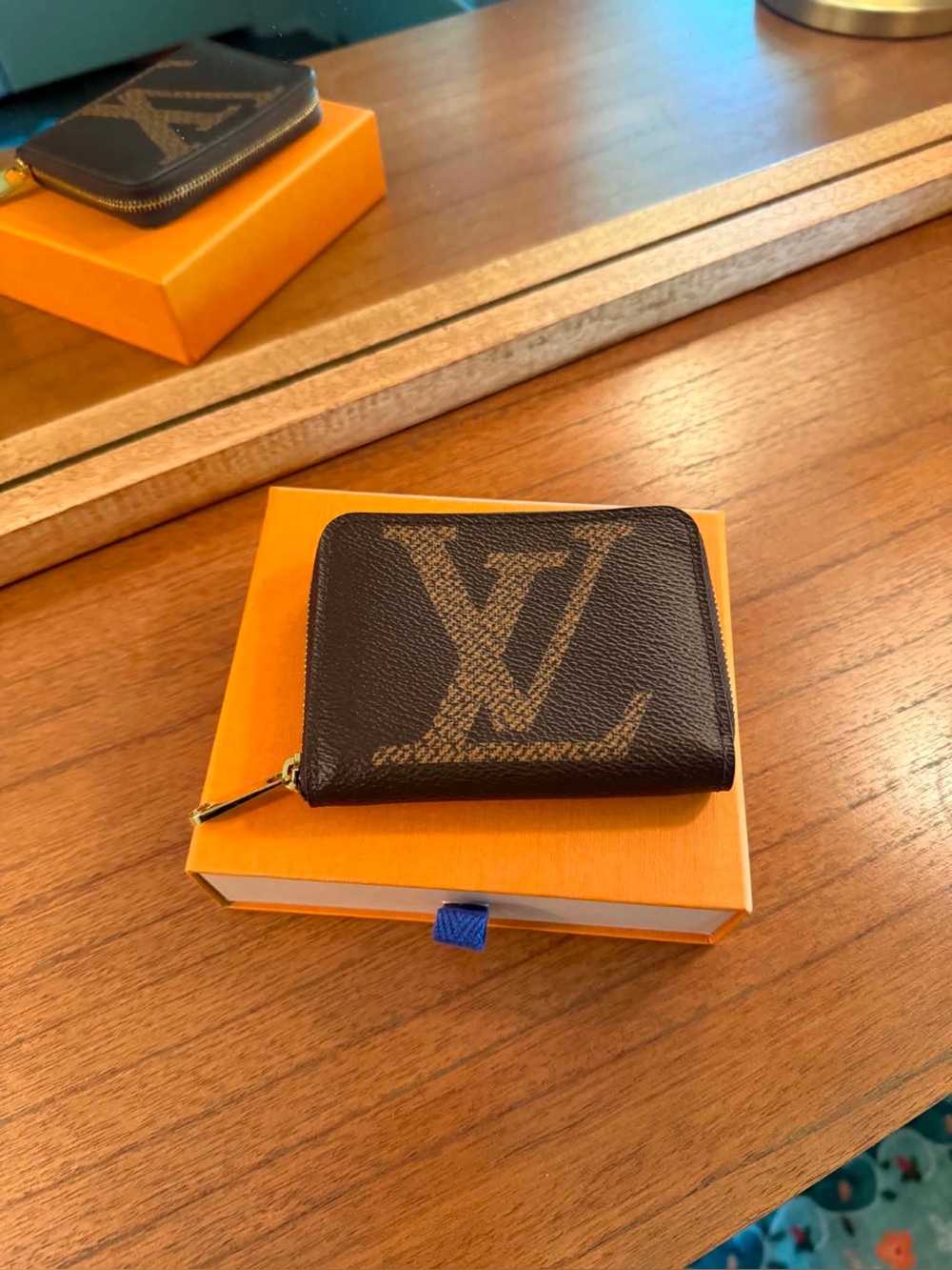 Louis Vuitton Zippy coin purse.